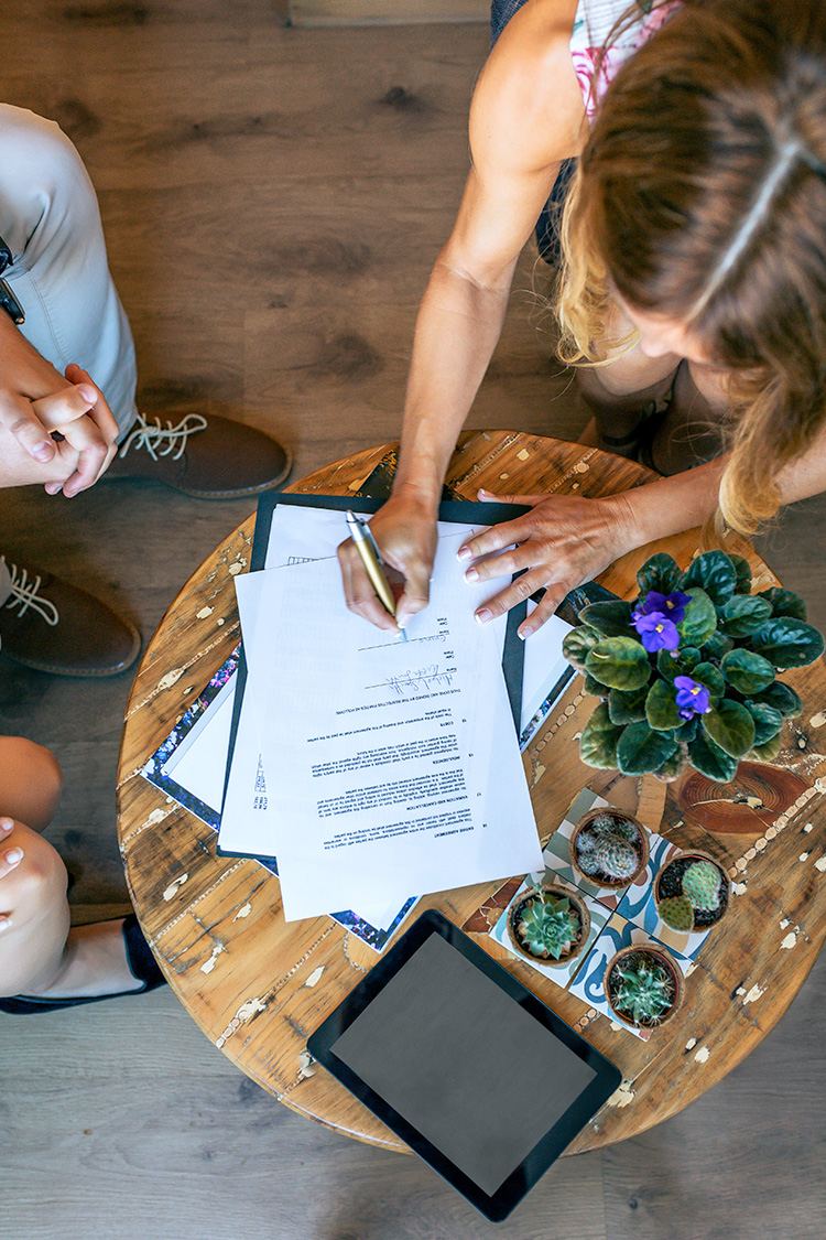Rental-property documents being reviewed and signed
