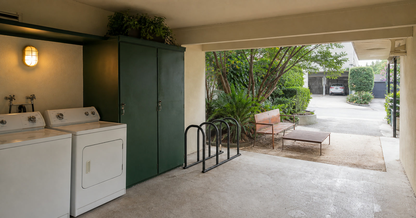 Shared laundry, bicycle storage, sitting court, and parking access at a Santa Monica rental property
