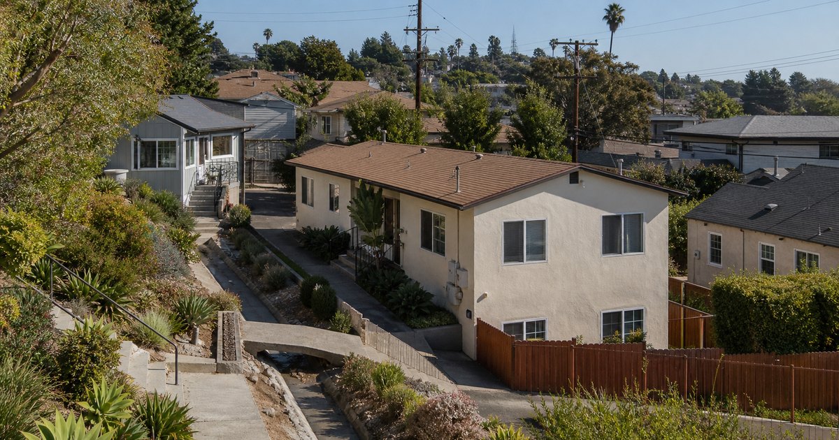 California property shown with driveway access, neighboring parcels, and utility context