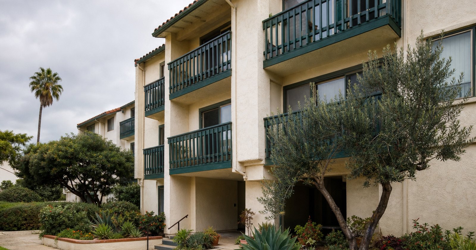 Small California condominium building with individually expressed balconies and shared entry